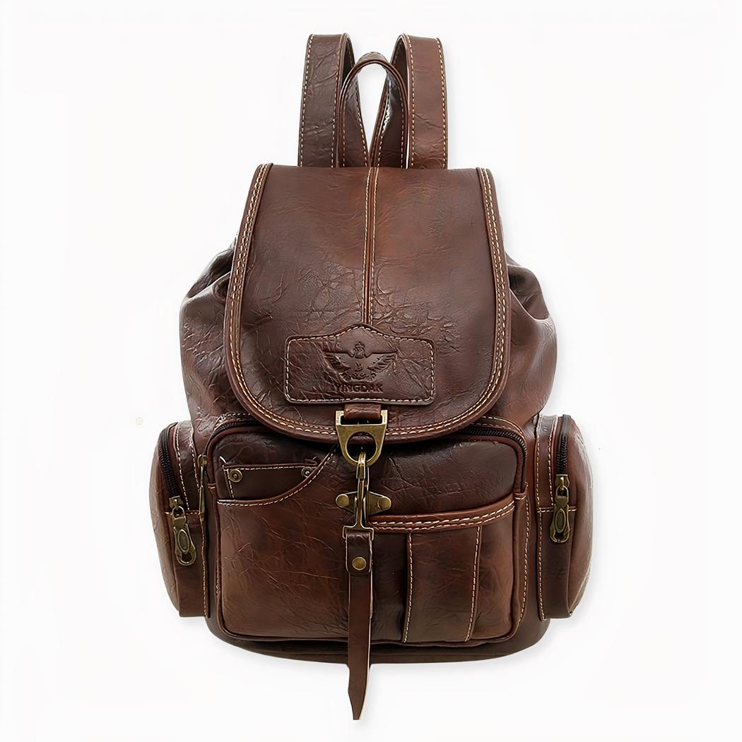 Een kleine rugzak van imitatieleer in vintage-stijl. Deze tas heeft meerdere vakken aan de voorkant en twee vakken met ritssluiting aan de zijkanten en één aan de achterkant.