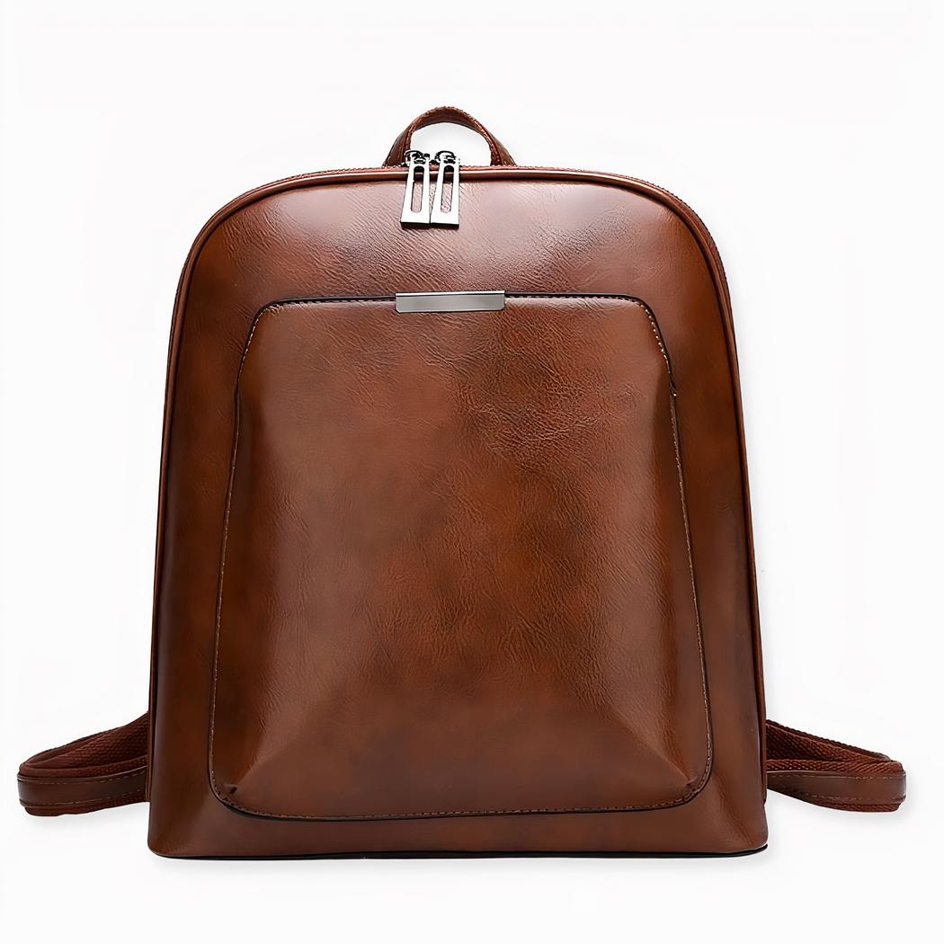Val voor deze kleine rugzak van effen imitatieleer! Hij is zo eenvoudig dat hij uw belangrijkste bondgenoot zal zijn om uw outfits een trendy tintje te geven, en hij past gemakkelijk bij uw hele garderobe. Dankzij de twee geïntegreerde handvatten kunt u hem met de hand of over de schouder dragen.