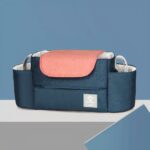 Polyester opbergtas voor blauwe en roze kinderwagens met blauwe achtergrond